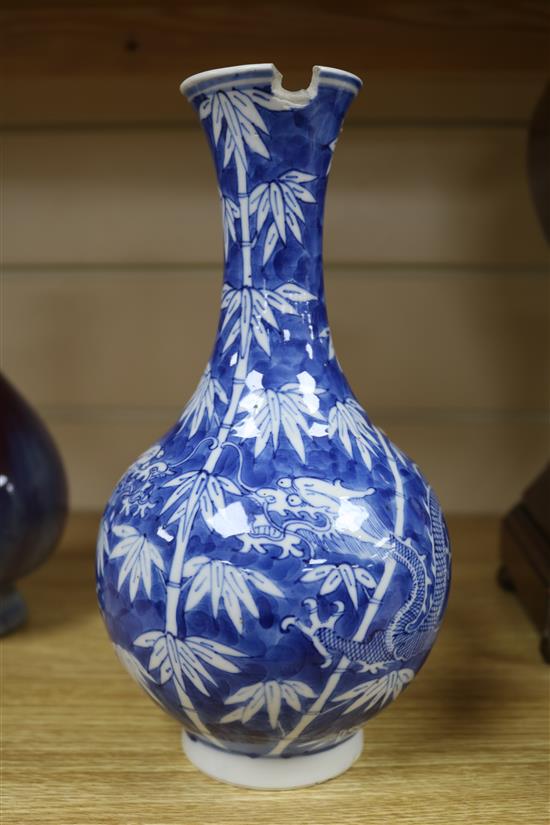 A Chinese blue and white dragon vase and a flambe vase tallest 22.5cm